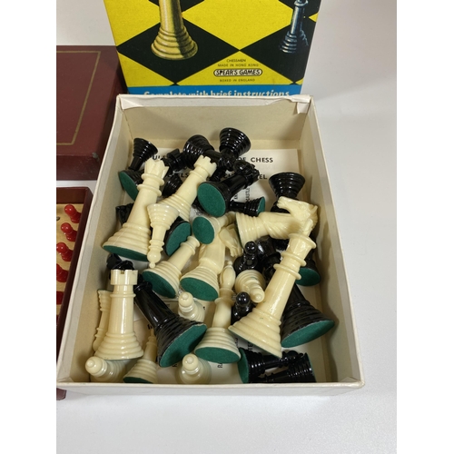 105 - TWO CHESS SETS - BOXED PLASTIC CHESSMEN AND T.S.L TRAVELLING SET, BOTH COMPLETE