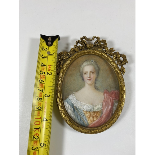 7 - A 19TH CENTURY HAND PAINTED PORTRAIT OF A LADY, INDISTINCTLY SIGNED, IN GILT RIBBON FRAME, LENGTH 10... 