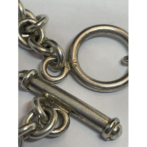 526 - A SILVER HALF ALBERT CHAIN WITH A HALLMARKED BIRMINGHAM FOB