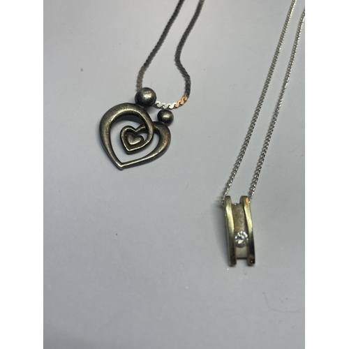 529 - FOUR SILVER NECKLACES WITH PENDANTS