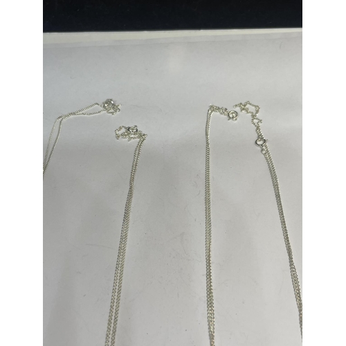 541 - FOUR SILVER NECKLACES WITH PENDANTS