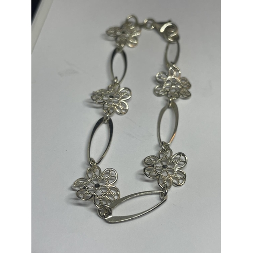 542 - THREE SILVER BRACELETS