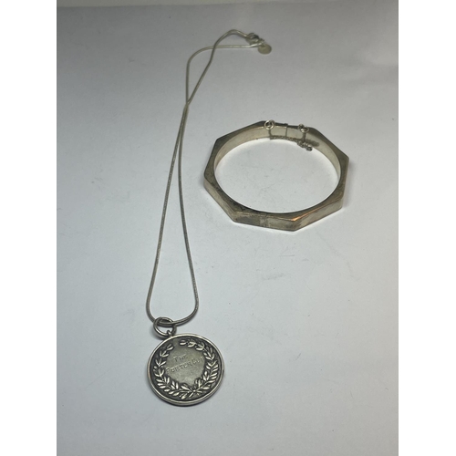 549 - A SILVER BANGLE AND A SILVER NECKLACE WITH PENDANT