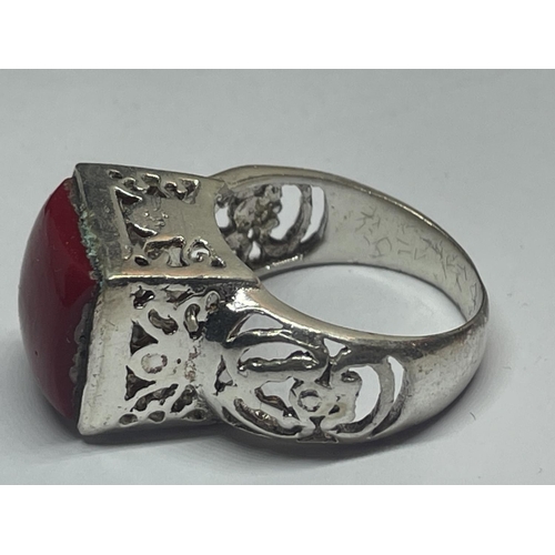 566 - A DECORATIVE SILVER RING WITH A SQUARE RED STONE IN A PRESENTATION BOX