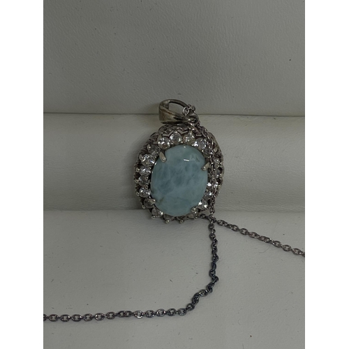 575 - A SILVER NECKLACE WITH A LARIMAR AND ZIRCON PENDANT AND A MATCHING RING IN A PRESENTATION BOX