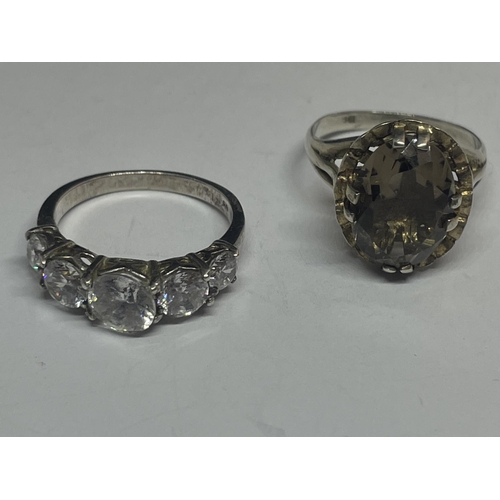 585 - FOUR VARIOUS SILVER RINGS