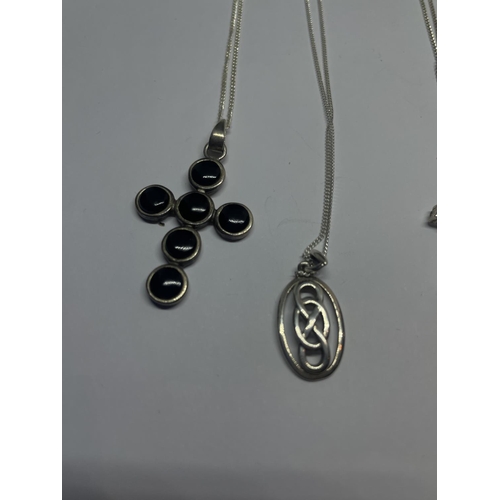 594 - FOUR SILVER NECKLACES WITH PENDANTS