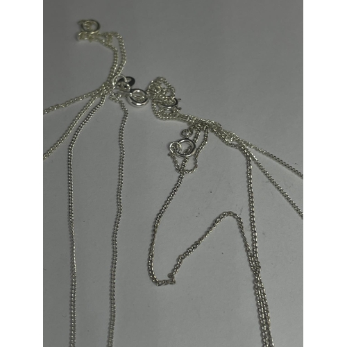 594 - FOUR SILVER NECKLACES WITH PENDANTS