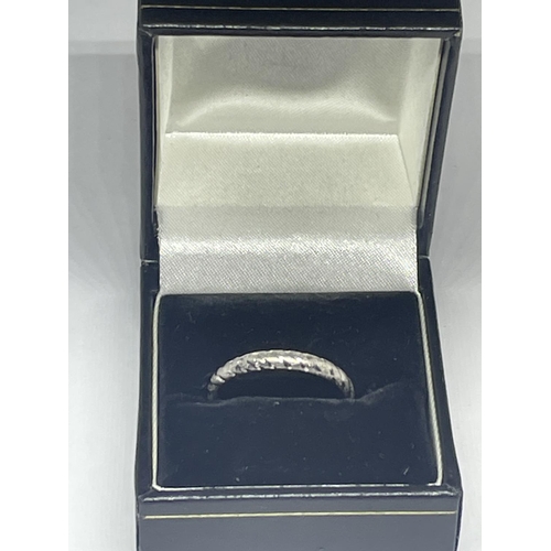 602 - A 9 CARAT WHITE GOLD WEDDING BAND IN A PRESENTATION BOX