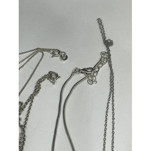 603 - FOUR SILVER NECKLACES WITH PENDANTS