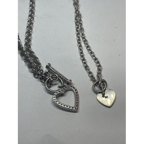 626 - TWO SILVER T BAR NECKLACES WITH HEART PENDANTS