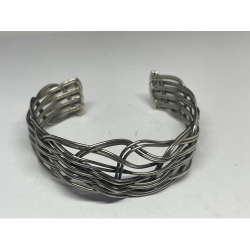 627 - A SILVER SEVEN BAR GATE BRACELET WITH HEART PADLOCK AND A SILVER WEAVE DESIGN BANGLE