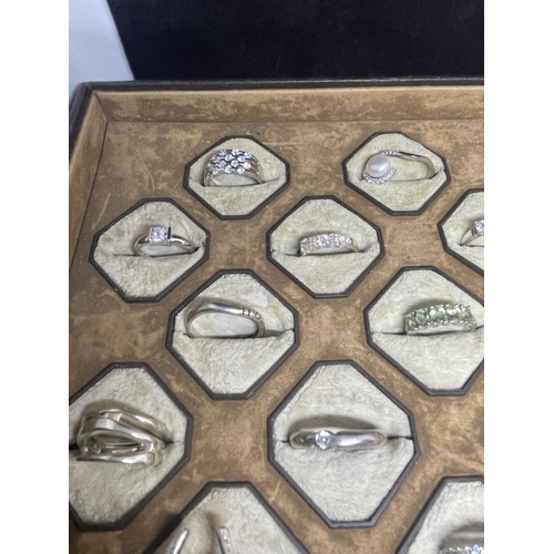 628 - A PRESENTATION TRAY OF 24 VARIOUS SILVER RINGS