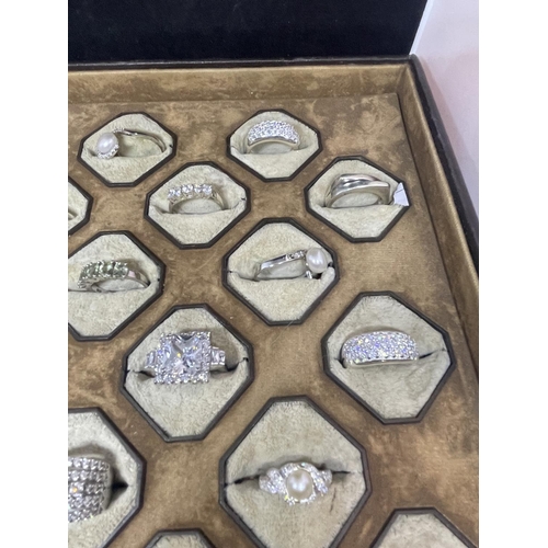 628 - A PRESENTATION TRAY OF 24 VARIOUS SILVER RINGS