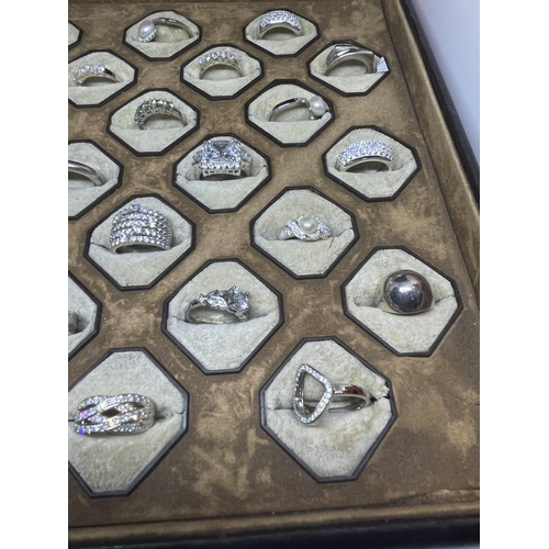 628 - A PRESENTATION TRAY OF 24 VARIOUS SILVER RINGS