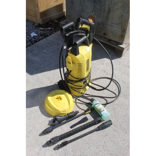 90A - AN ELECTRIC KARCHER PRESSURE WASHER COMPLETE WITH ATTACHMENTS - NO VAT