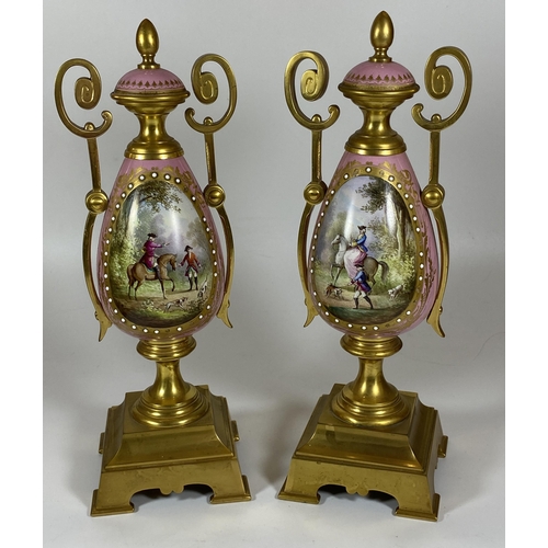 17 - A PAIR OF FRENCH 19TH CENTURY, POSSIBLY SEVRES, PINK PORCELAIN AND BRASS GARNITURE VASES WITH HAND P... 