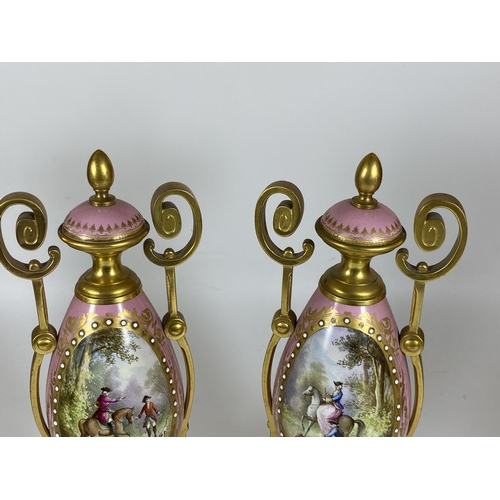 17 - A PAIR OF FRENCH 19TH CENTURY, POSSIBLY SEVRES, PINK PORCELAIN AND BRASS GARNITURE VASES WITH HAND P... 