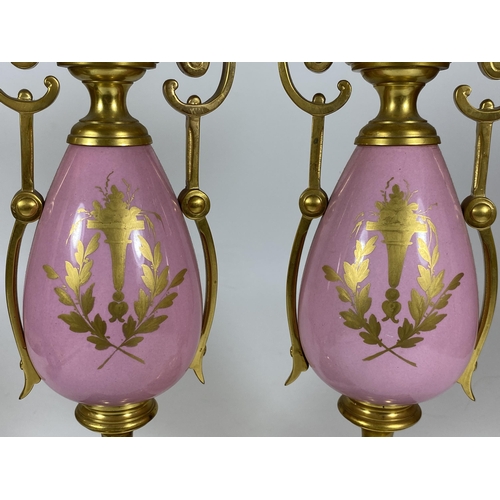 17 - A PAIR OF FRENCH 19TH CENTURY, POSSIBLY SEVRES, PINK PORCELAIN AND BRASS GARNITURE VASES WITH HAND P... 