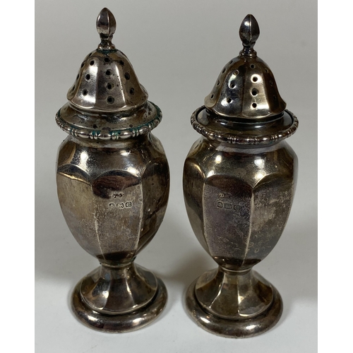 21 - A PAIR OF BIRMINGHAM HALLMARKED SILVER SALT AND PEPPER SHAKERS, HEIGHT 10.5CM, TOTAL WEIGHT 84G