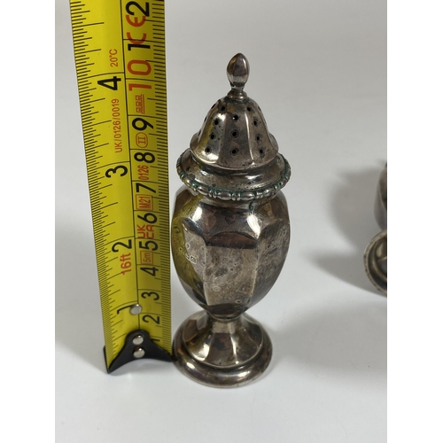 21 - A PAIR OF BIRMINGHAM HALLMARKED SILVER SALT AND PEPPER SHAKERS, HEIGHT 10.5CM, TOTAL WEIGHT 84G