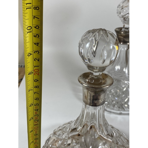 29 - A CUT GLASS SHIPS DECANTER WITH HALLMARKED SILVER COLLAR, HALLMARKS FOR LONDON, 2002, MAKERS HARRISO... 