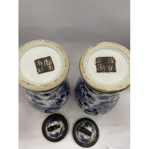 41 - A PAIR OF LATE 19TH CENTURY CHINESE CRACKLE GLAZE BLUE AND WHITE LIDDED TEMPLE VASES, SEAL MARKS TO ... 