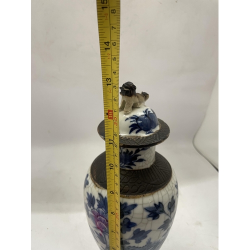 41 - A PAIR OF LATE 19TH CENTURY CHINESE CRACKLE GLAZE BLUE AND WHITE LIDDED TEMPLE VASES, SEAL MARKS TO ... 