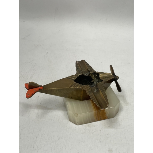 49 - A VINTAGE ART DECO BRASS AEROPLANE ASHTRAY ON ONYX STAND