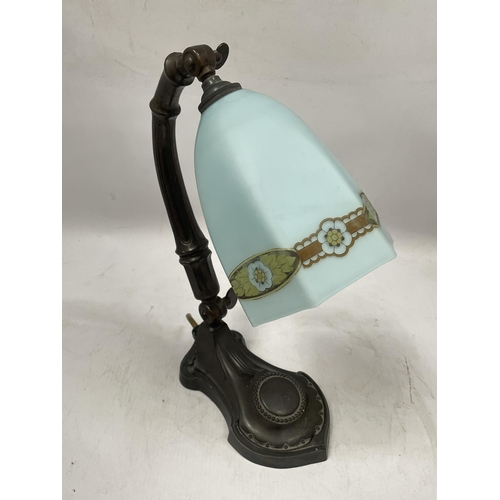 50 - AN ART NOUVEAU METAL TABLE LAMP WITH FROSTED GLASS SHADE