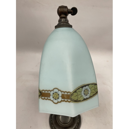 50 - AN ART NOUVEAU METAL TABLE LAMP WITH FROSTED GLASS SHADE