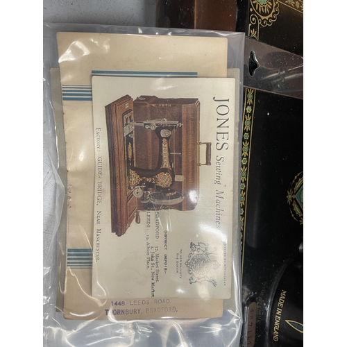 58 - A VINTAGE CASED JONES SEWING MACHINE WITH ORIGINAL BOOKLET