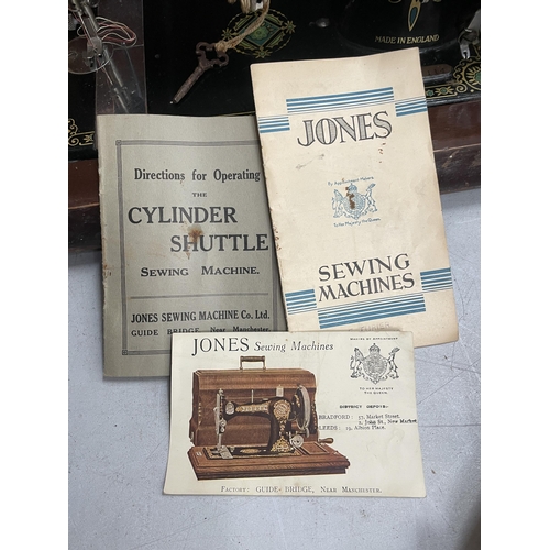 58 - A VINTAGE CASED JONES SEWING MACHINE WITH ORIGINAL BOOKLET