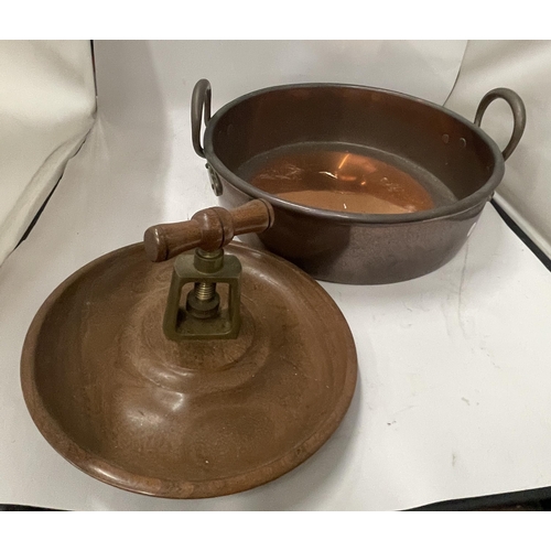 63 - A VINTAGE TWIN HANDLED COPPER BOWL WITH TREEN NUTCRACKER BOWL