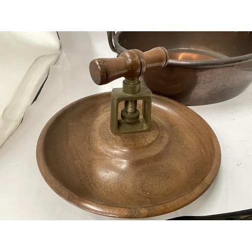 63 - A VINTAGE TWIN HANDLED COPPER BOWL WITH TREEN NUTCRACKER BOWL