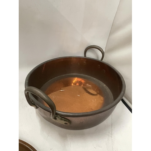 63 - A VINTAGE TWIN HANDLED COPPER BOWL WITH TREEN NUTCRACKER BOWL