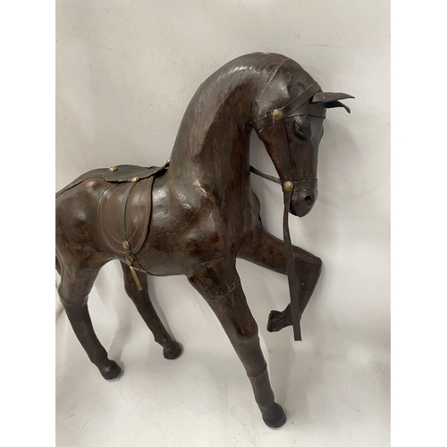 73 - A LARGE VINTAGE LEATHER MODEL OF A HORSE