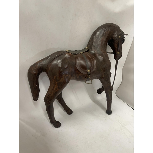 73 - A LARGE VINTAGE LEATHER MODEL OF A HORSE