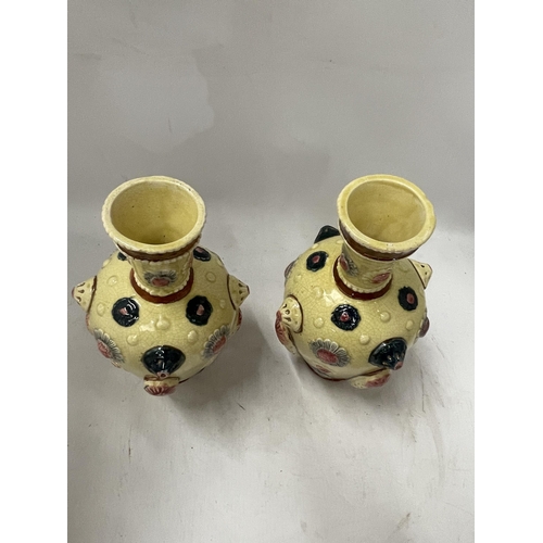 78 - A PAIR OF CONTINENTAL PORCELAIN VASES IN THE ZSOLNAY PECS STYLE, UNMARKED