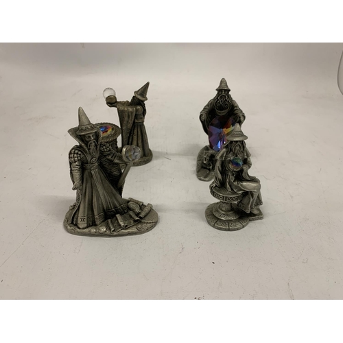 121 - FOUR PEWTER STYLE WIZARDS WITH CRYSTALS