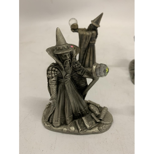 121 - FOUR PEWTER STYLE WIZARDS WITH CRYSTALS