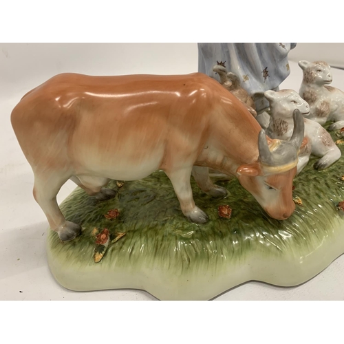 126 - A VINTAGE CERAMIC TABLEAU OF A LADY WITH FARM ANIMALS WITH BLUE CROSSED SWORDS AND R TO BASE