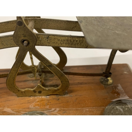 136 - A SET OF BRASS AND WOOD POST OFFICE SCALES WITH WEIGHTS