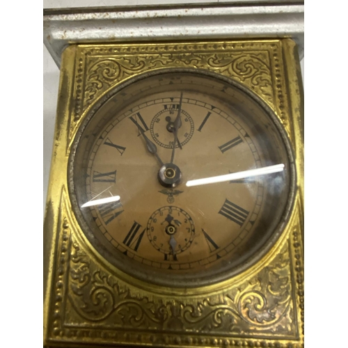 169A - A VINTAGE BRASS AND METAL MANTLE CLOCK