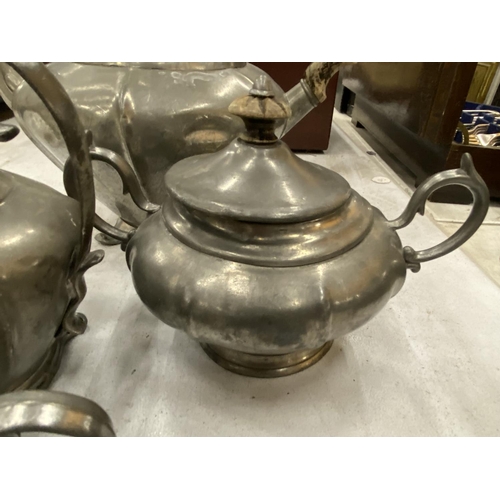 181 - A PEWTER TEASET TO INCLUDE TEAPOT, SUGAR, MILK AND HOT WATER JUG