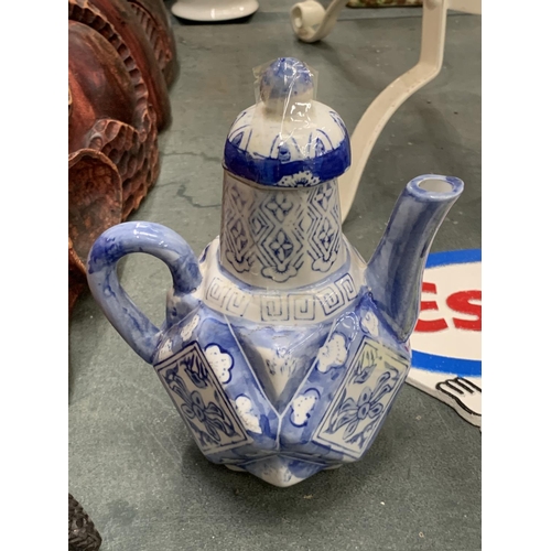 216 - TWO ORIENTAL STYLE BLUE AND WHITE TEAPOTS