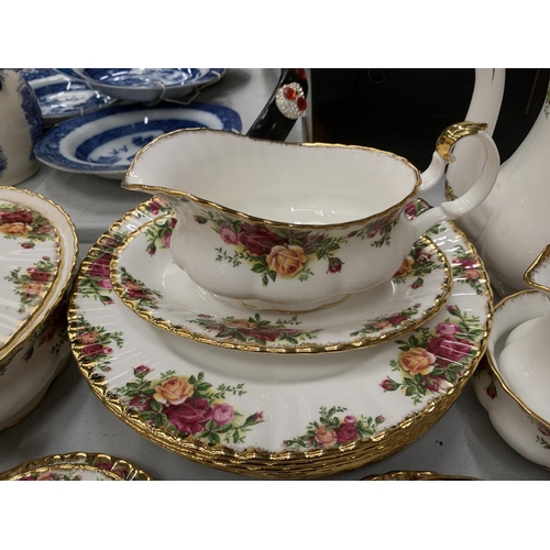 219 - A LARGE QUANTITY OF ROYAL ALBERT OLD COUNTRY ROSES TO INCLUDE COFFEEPOTS, BUTTER DISH, UTENSILS, DIN... 