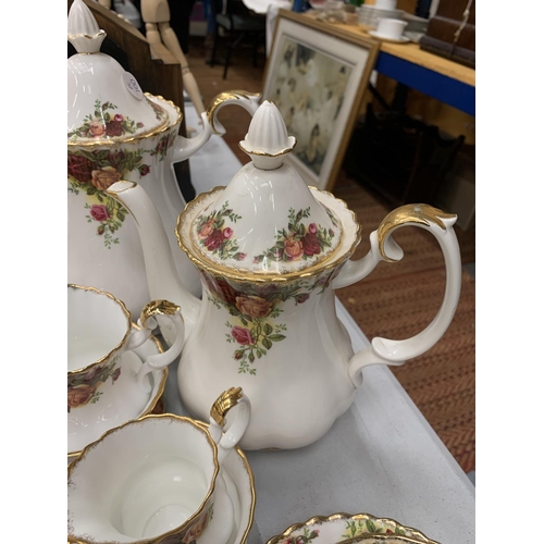 219 - A LARGE QUANTITY OF ROYAL ALBERT OLD COUNTRY ROSES TO INCLUDE COFFEEPOTS, BUTTER DISH, UTENSILS, DIN... 