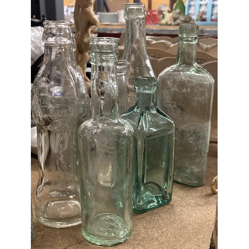 812 - A COLLECTION OF VINTAGE GLASS BOTTLES