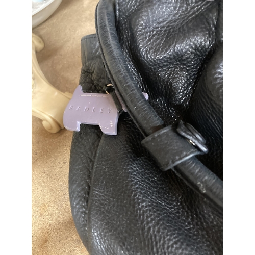 854 - A BLACK RADLEY HANDBAG WITH DUST JACKET